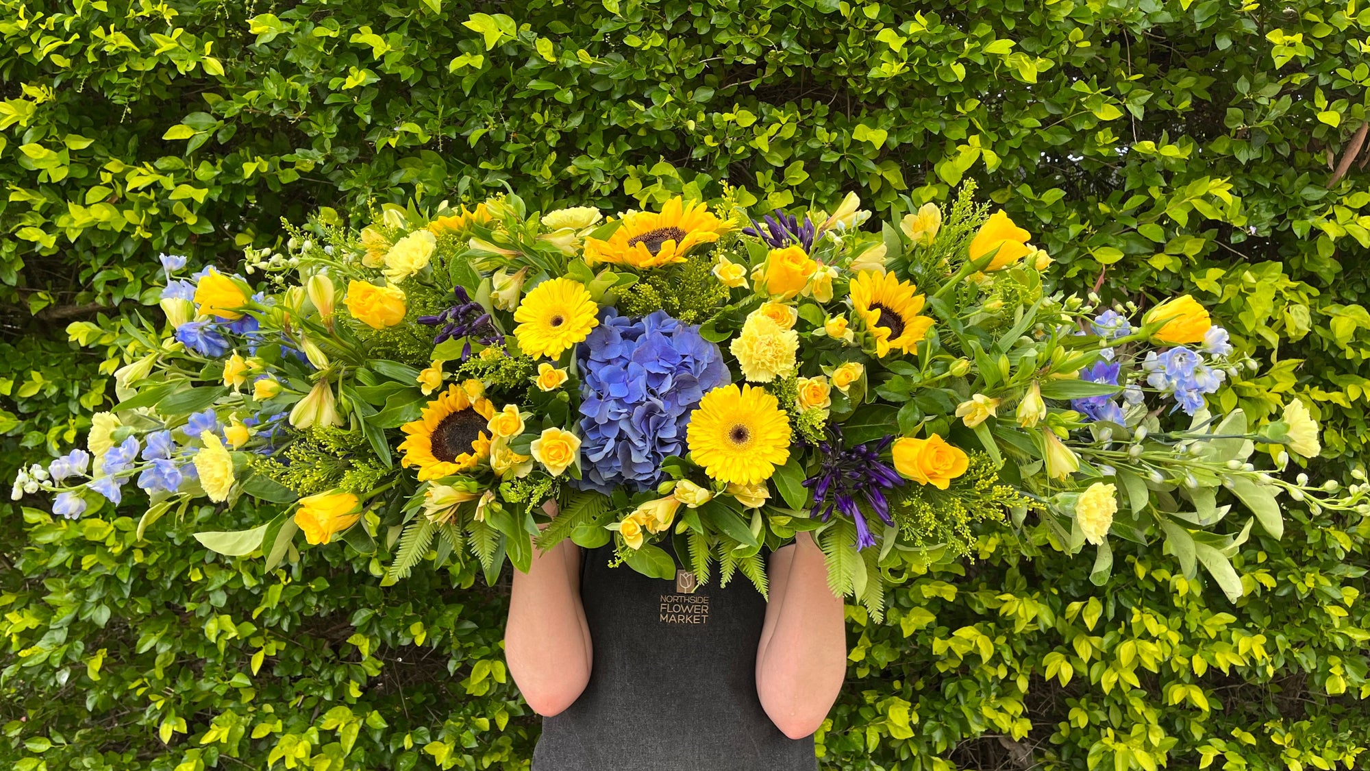 BLUE & YELLOW CASKET SPRAY